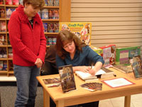 Verna signing her book